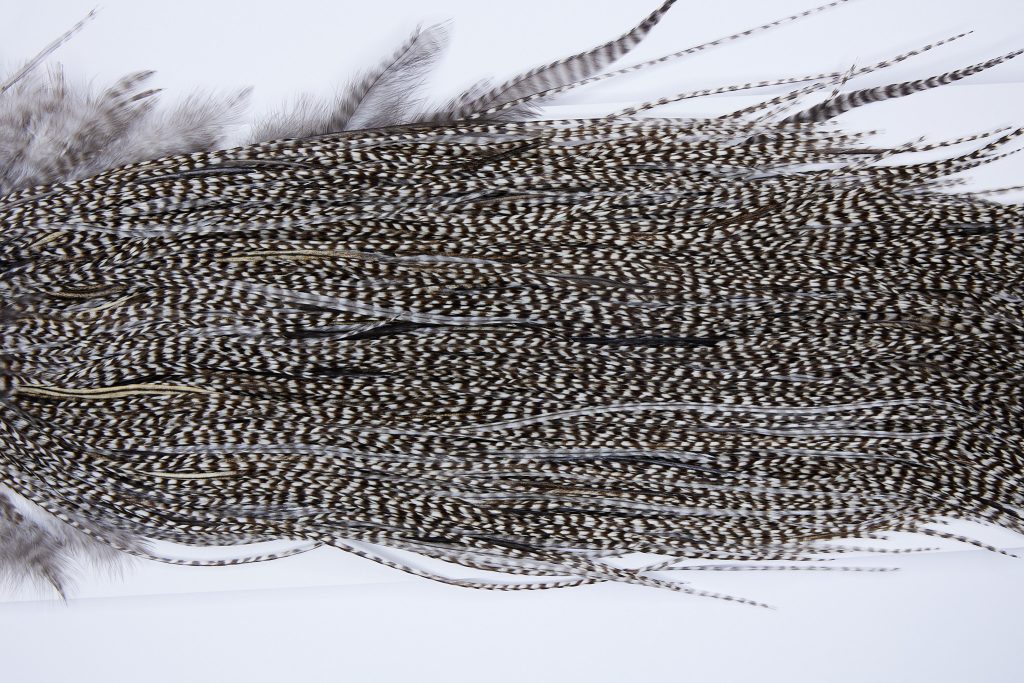 274 - Heritage Dry Fly Hackle, Grizzly Variant #3 Grade Rooster Saddle, Ties Sizes 14-16