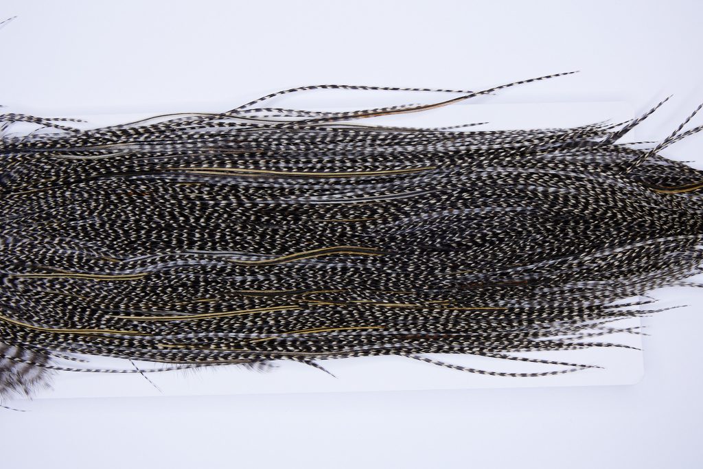 321 - Heritage Dry Fly Hackle, Grizzly Variant #2 Grade Rooster Saddle, Ties Sizes 14-18