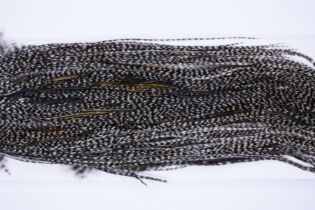 322 - Heritage Dry Fly Hackle, Grizzly Variant #2 Grade Rooster Saddle, Ties Sizes 14-18