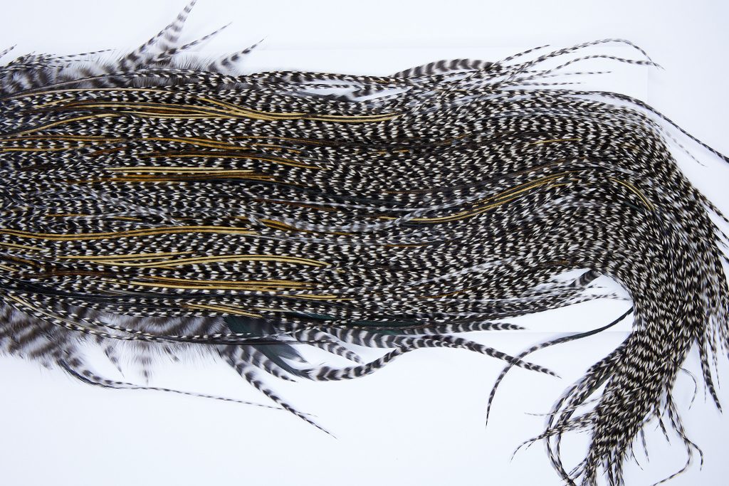 543 - Hebert Dry Fly Hackle, Grizzly Variant Silver Grade Rooster Saddle, Ties Sizes 14-16