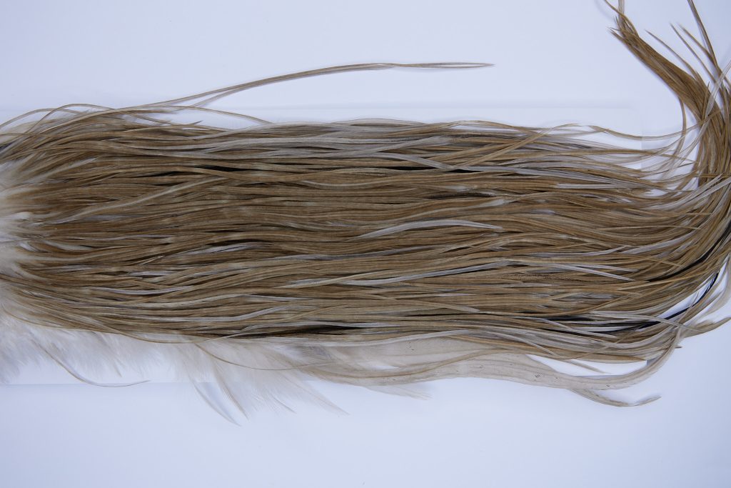 793 - Hebert Dry Fly Hackle, Light Tan Dun Bronze Grade Rooster Saddle, Ties Sizes 12-14