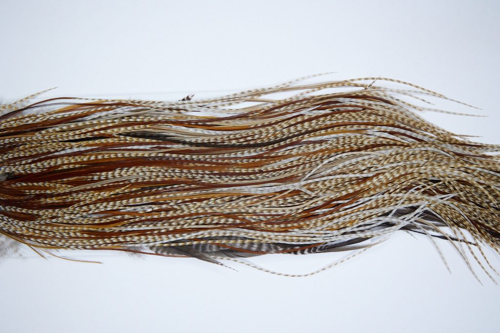 3681 Hebert Dry Fly Hackle, Gold Grade Rooster Saddle Medium Barred Ginger Ties Size 14-16