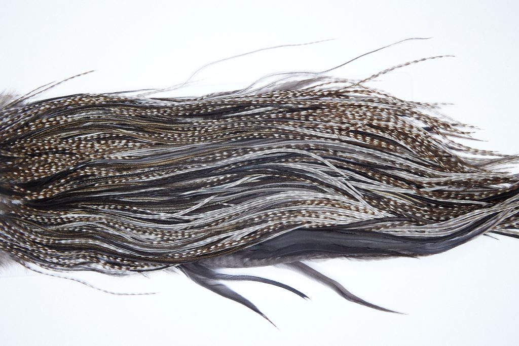 3976 Hebert Dry Fly Hackle, Bronze Grade Rooster Saddle Dun Grizzly Ties Size 12-14