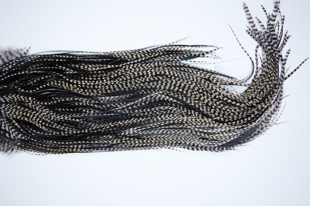 3985 Hebert Dry Fly Hackle, Bronze Grade Rooster Saddle Grizzly Variant Ties Size 14-16