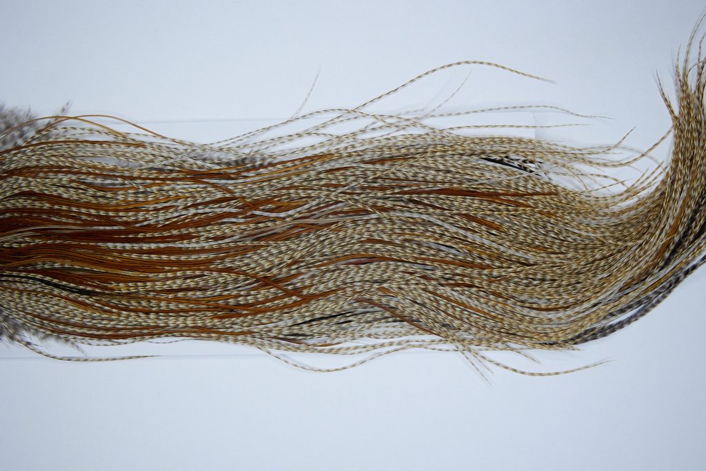 4016 Hebert Dry Fly Hackle, Silver Grade Rooster Saddle Medium Barred Ginger Ties Size 14-18